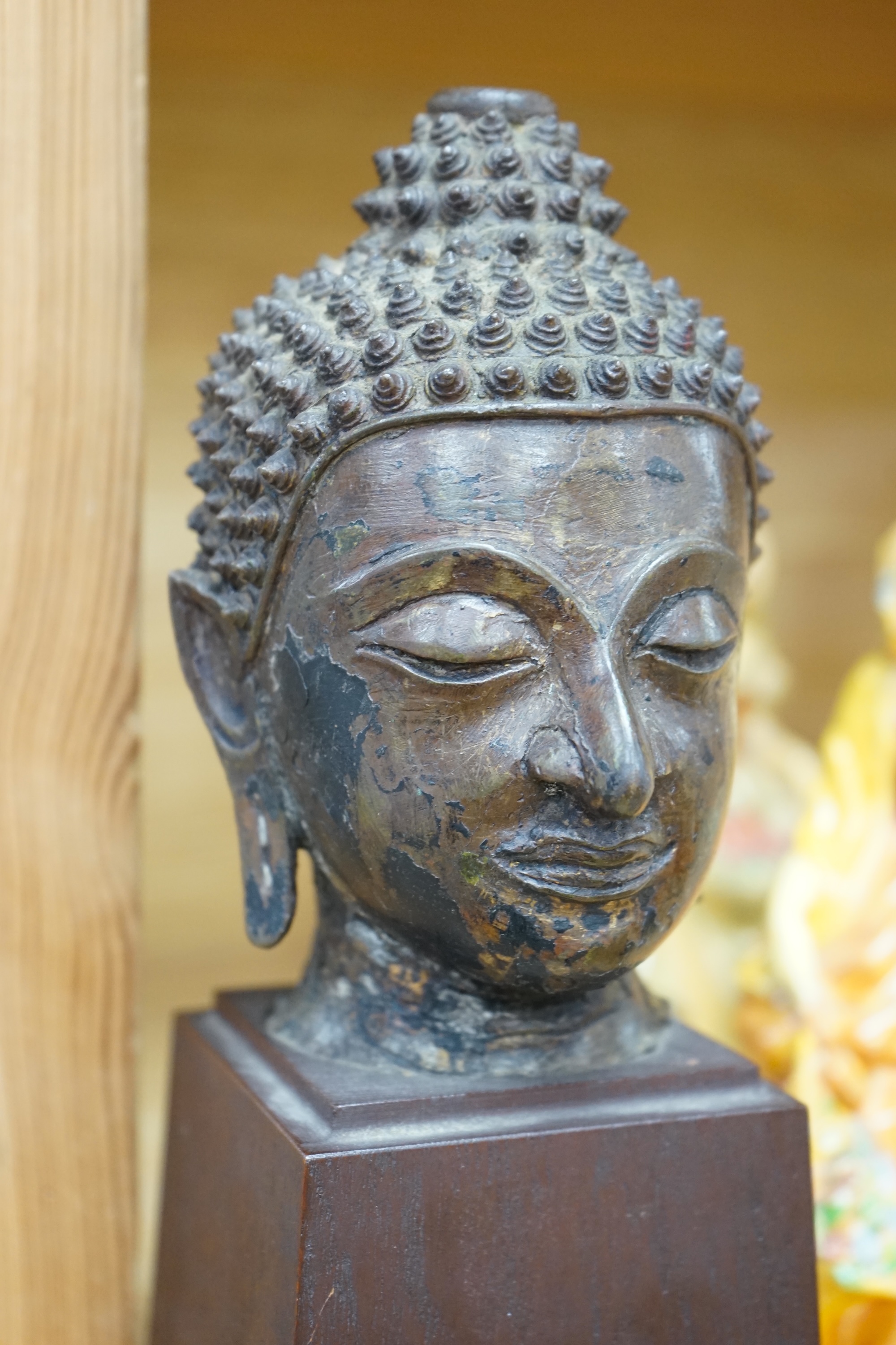 A Thai bronze head of Buddha, probably 18th century, 25cm high. Condition - good